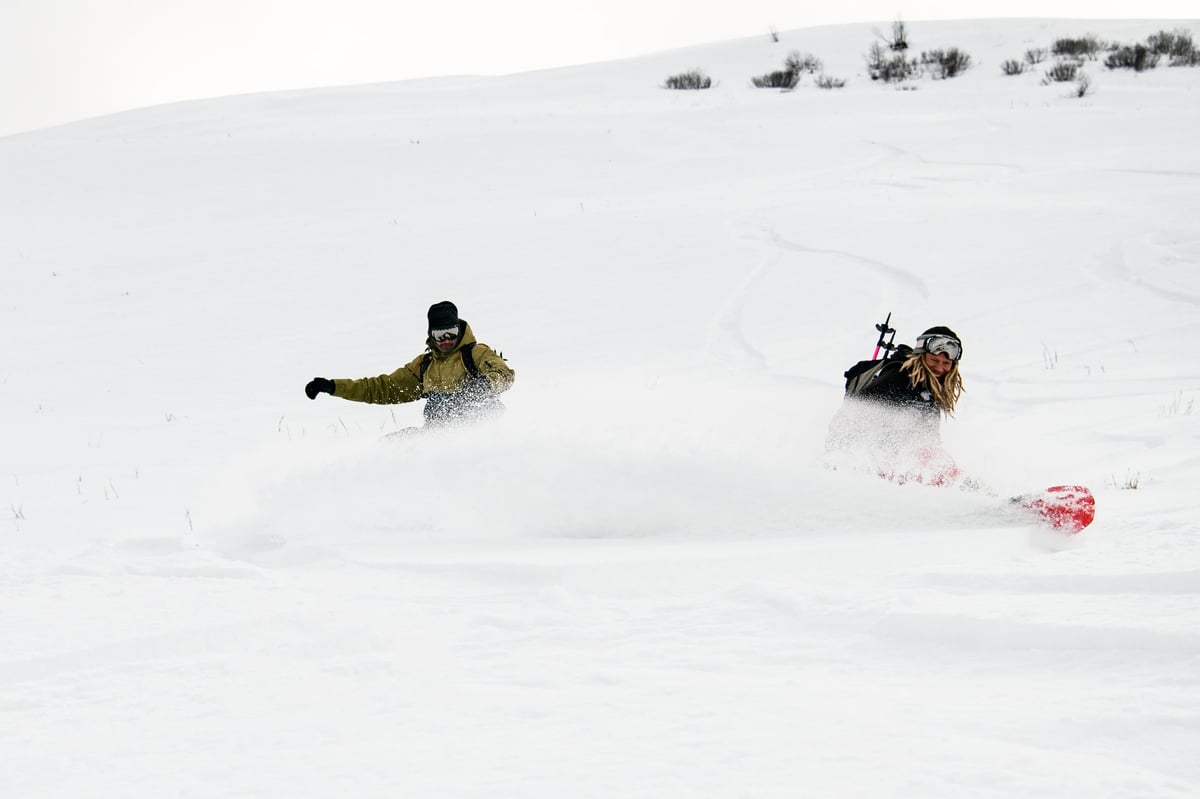 Catskiing Kazakhstan — freeriders carving through deep Altai powder