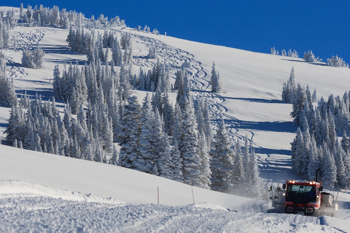 Catskiing Kazakhstan — snowcat on a sunny powder day in the Altai Mountains