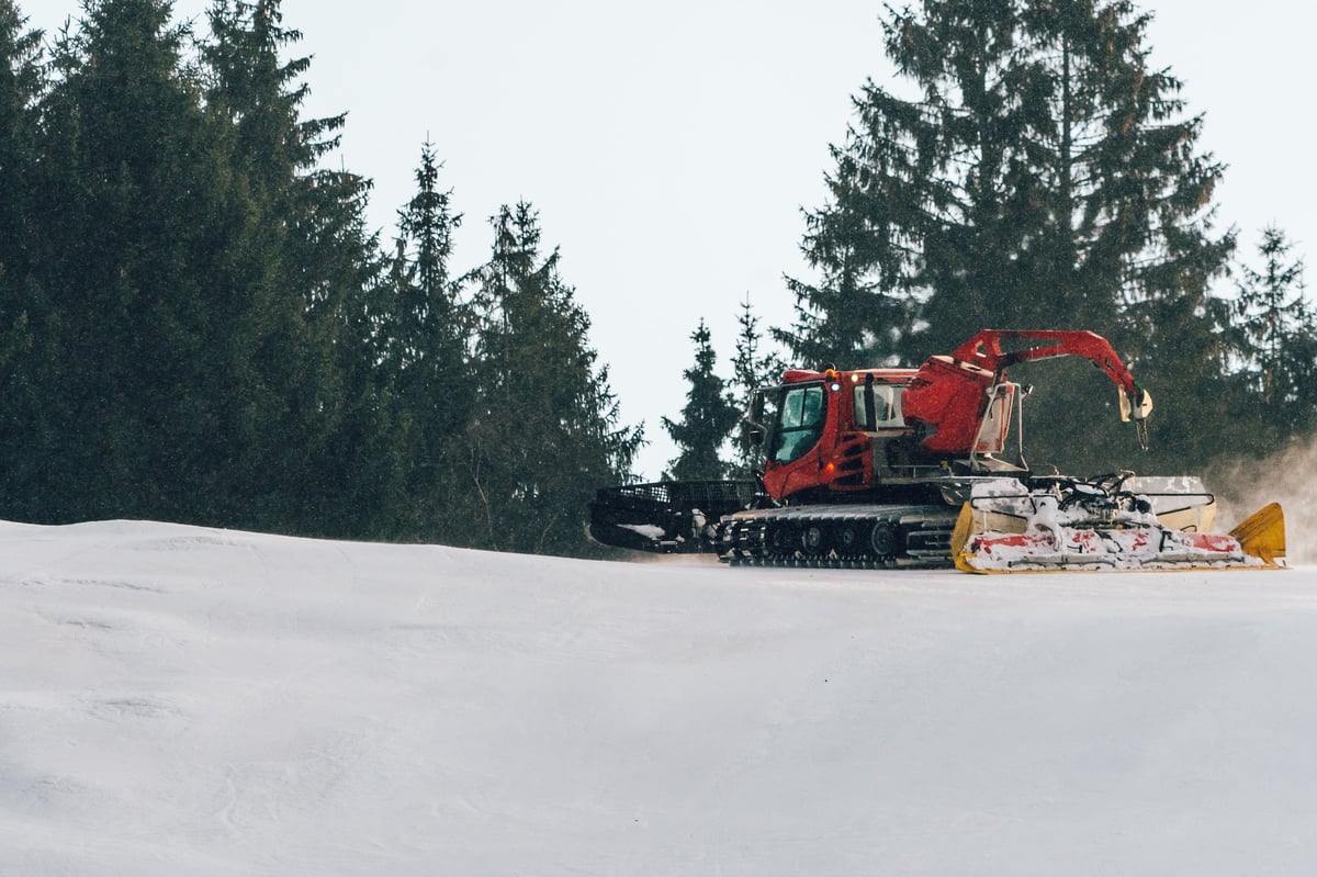 Catskiing Kazakhstan — snowcat on a steep powder slope in the Altai