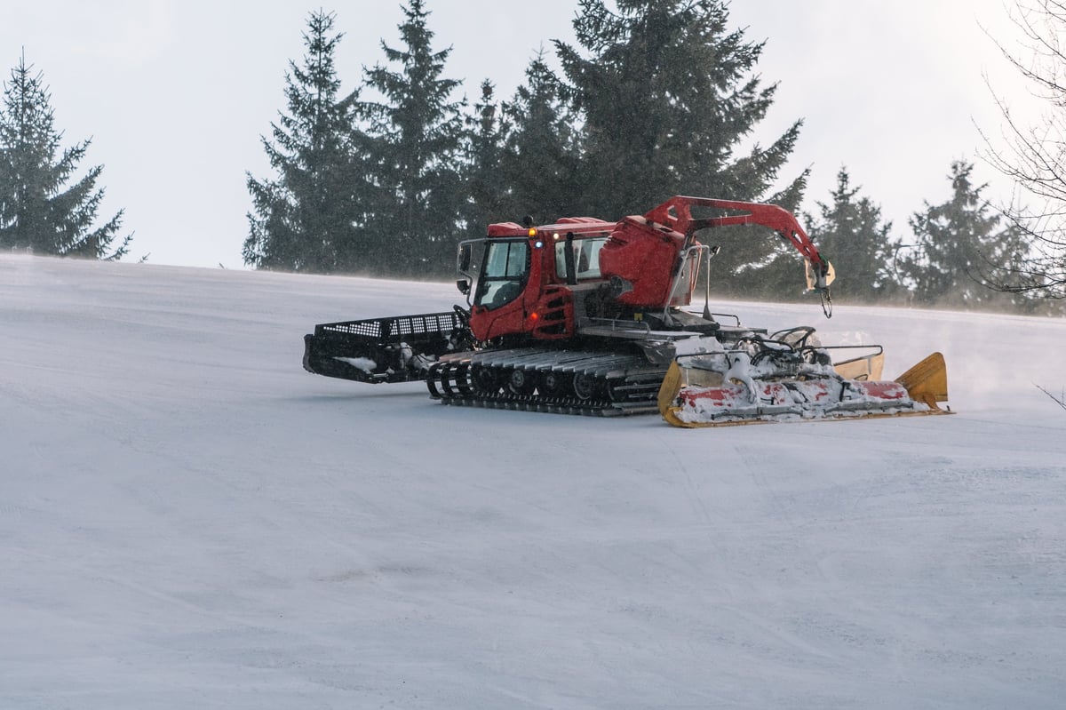 Catskiing Kazakhstan — snowcat on snowy ridge in East Kazakhstan